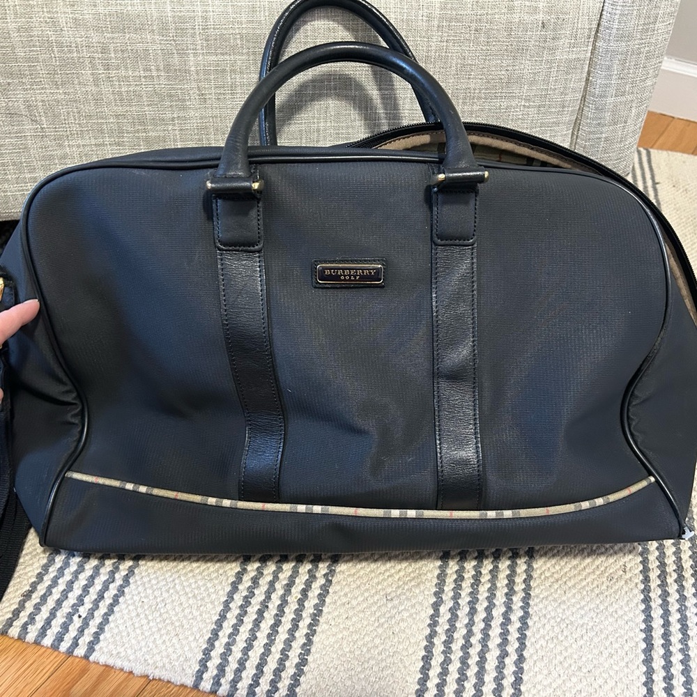 Burberry Black Travel Bag with Textured Material and Durable Base